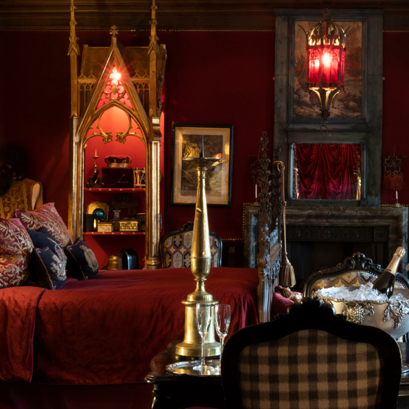 The Old Rectory Suite with rich textiles and antique elegance.
