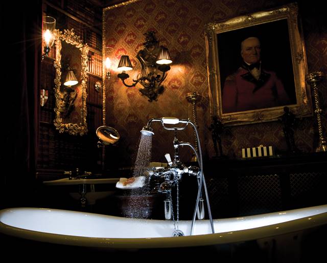 Free standing bath with extravagant gothic decor in the Old Rectory hotel suite's secret bathroom