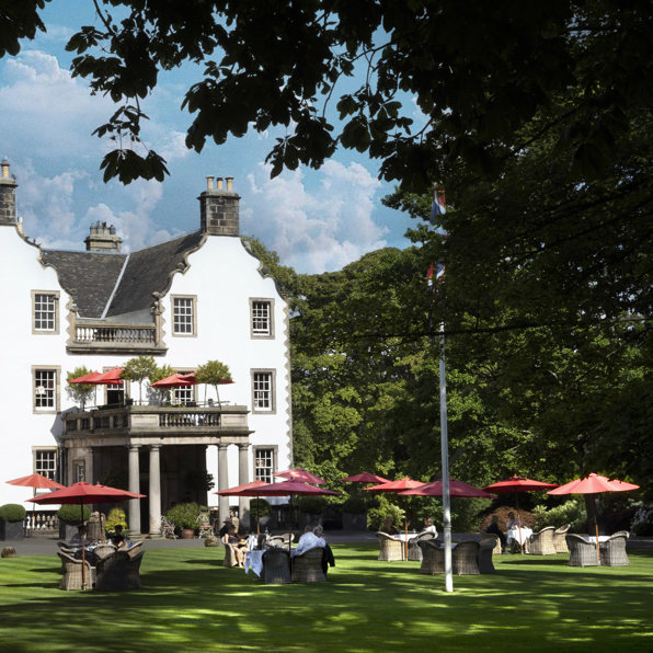 Guests dining alfresco at Prestonfield House, Edinburgh, on a summer's day 