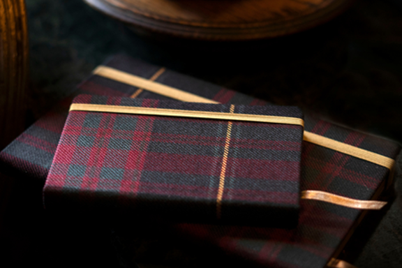 Tartan notebook sat on a marble desk