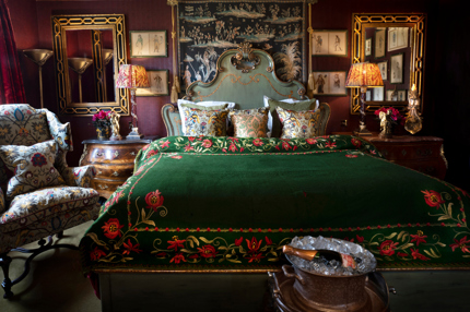 Green velvet bedding, Champagne and antiques in Room 16 at Prestonfield House 5 star hotel