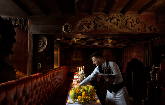 Waiter serving table in The Witchery Edinburgh