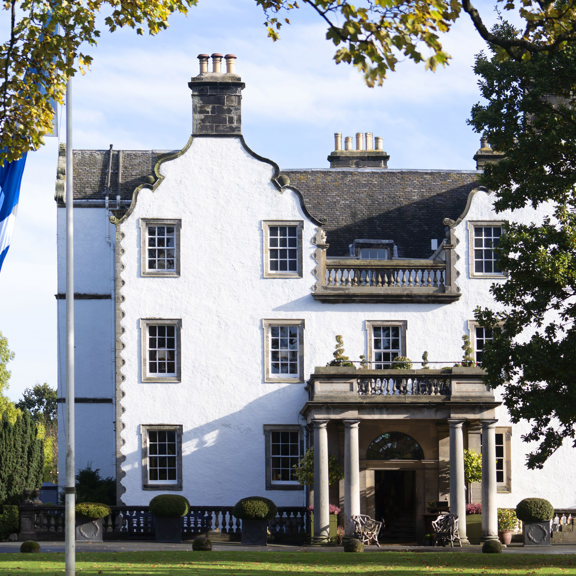 Prestonfield in Autumn with the Saltire Flag