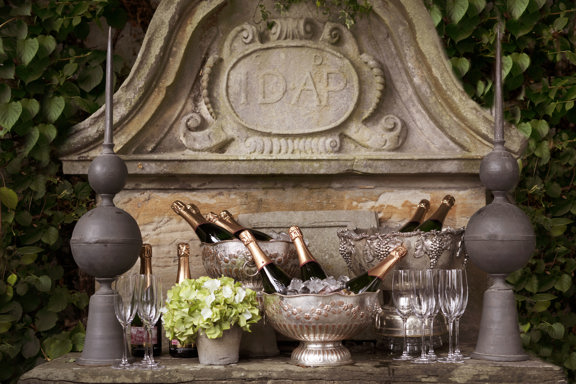 Champagne bottles and silver ice bucket outside on the Garden Room Terrace at Rhubarb restaurant in Edinburgh