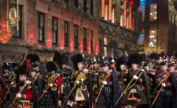 Pipe bands marching past The Witchery for the Edinburgh Tattoo