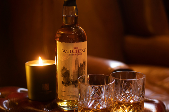The Witchery Whisky in crystal glasses by the fireplace