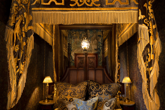 The bed front on in The Heriot Suite in The Witchery