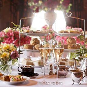 Champagne, tea, silver cake stands and pink flowers shown in Rhubarb, the best Edinburgh restaurant for afternoon tea
